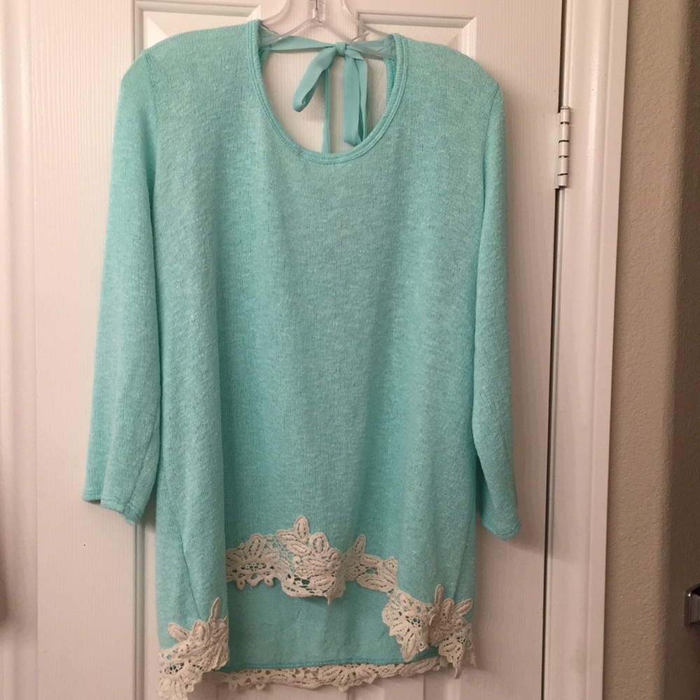 Sea foam green top with floral embellishments